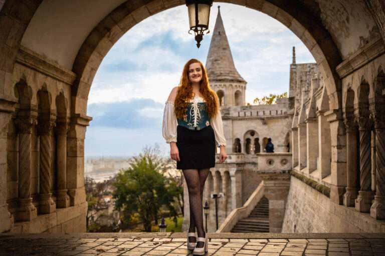 Model in front of buda castle in Budapest Hungary for a travel photoshoot