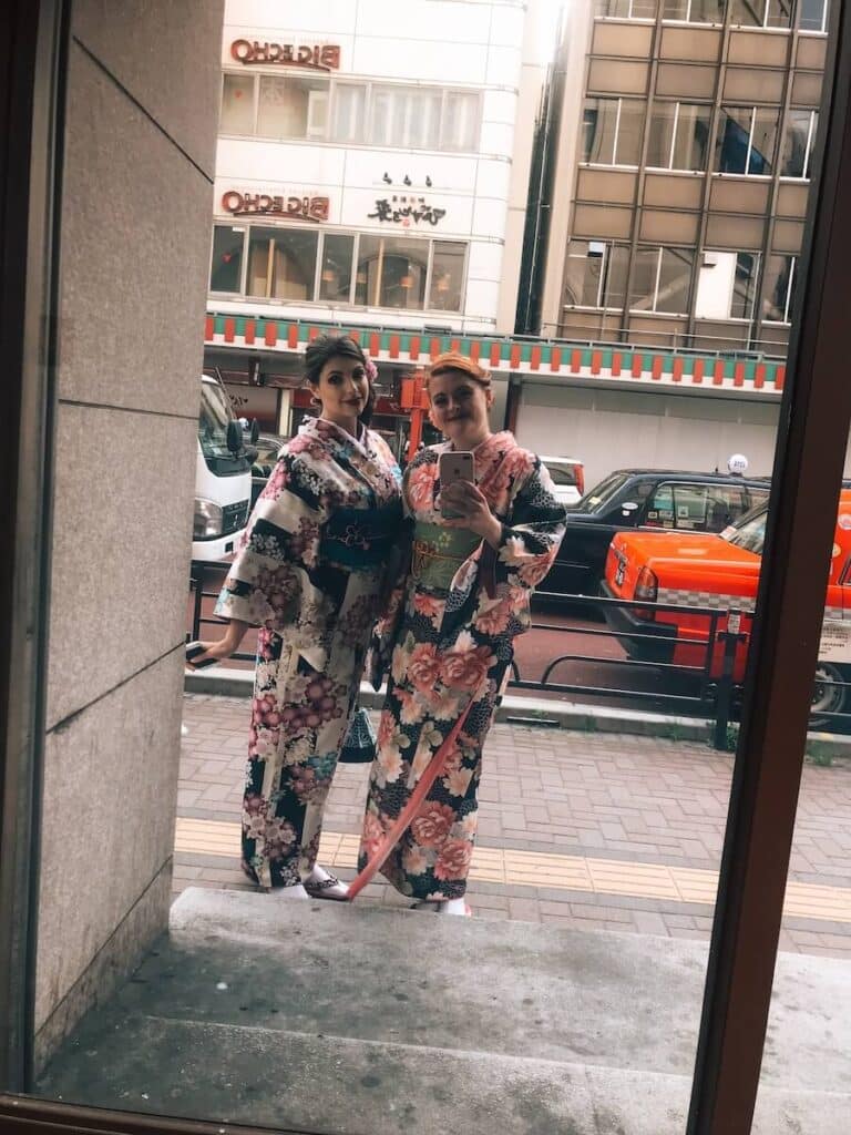 two friends wandering tokyo in a kimono