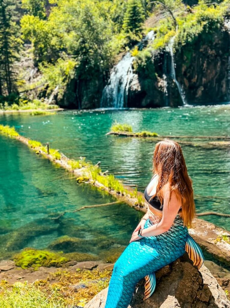 Mermaid with blue tail at hanging lake in Colorado