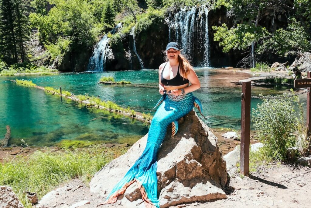 The bucket list mermaid posing in front of Hanging Lake in Colorado