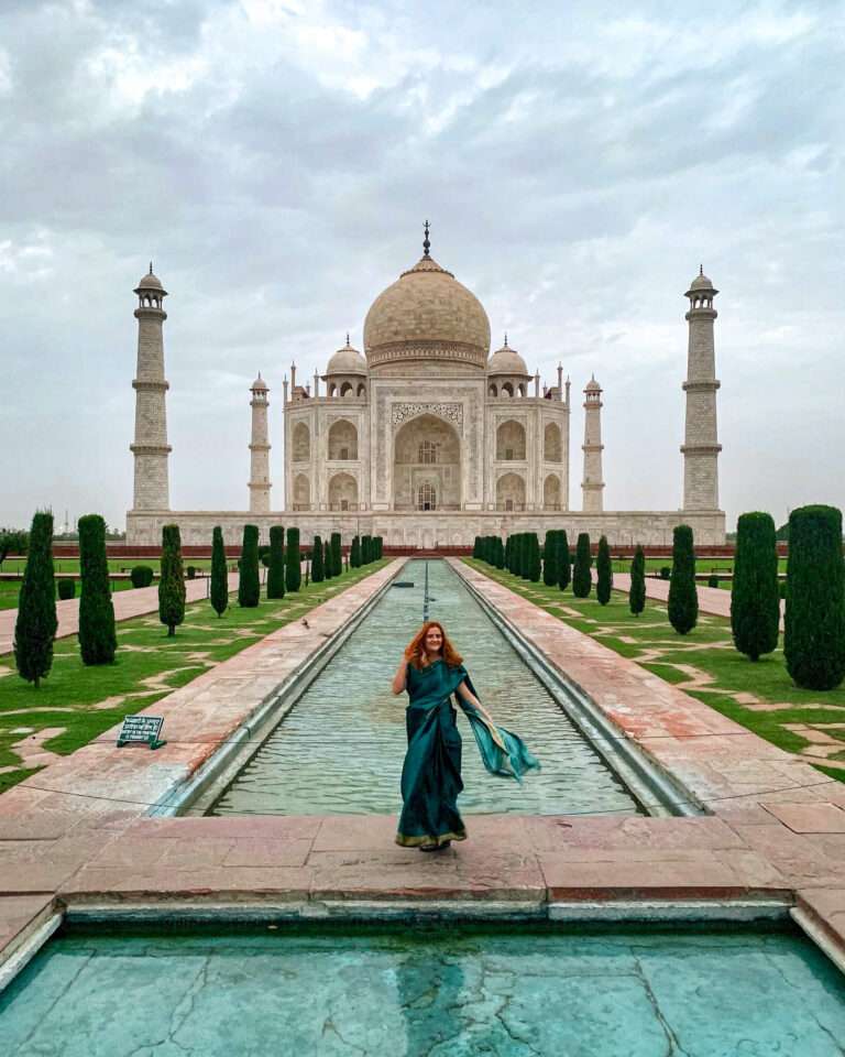 Red-haired girl in front of the Taj Mahal