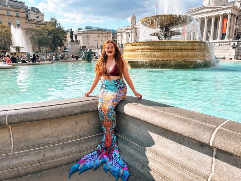 Mermaid posing in front of fountain in London