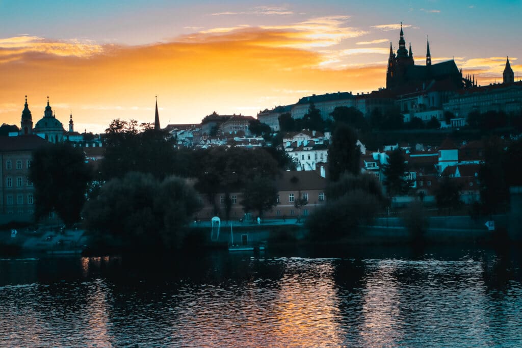 Sunset over river in Prague at night