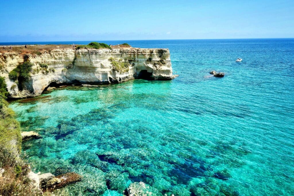 Rock formations and teal water at torre sant'andrea in Puglia, Italy