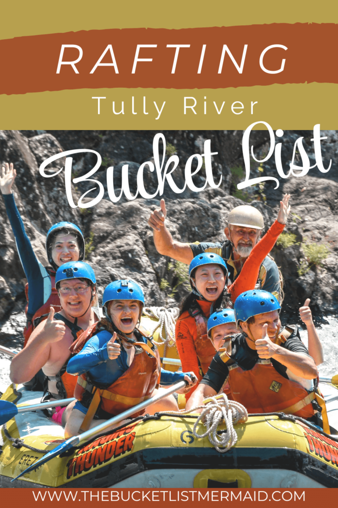 Pinterets pin: rafting Tully River Bucket List. A group of people smiling on the Tully River in Australia