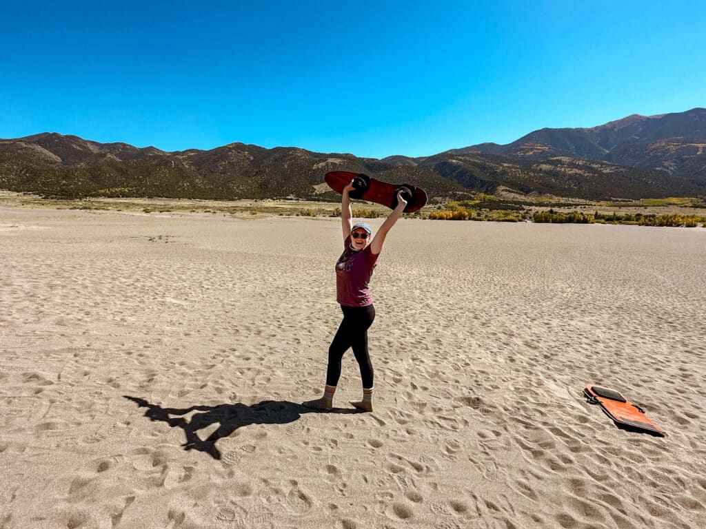 The Bucket List Mermaid checking off "sandboarding at the great sand dunes" off of her bucket list!