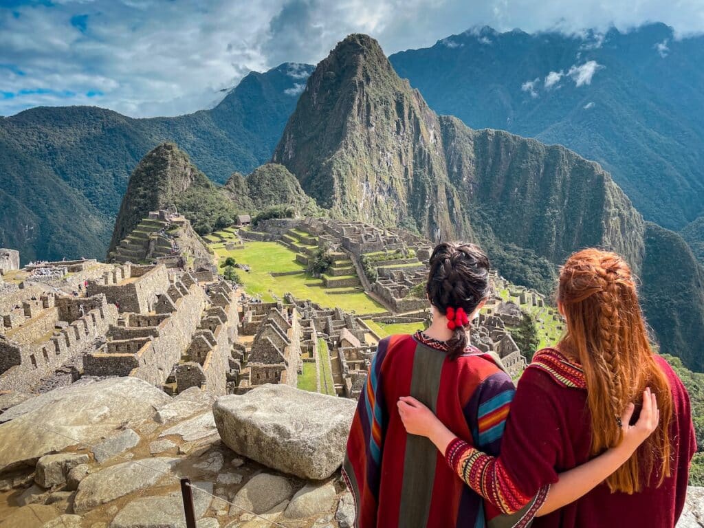 Two friends looking over Machu Picchu in Peru