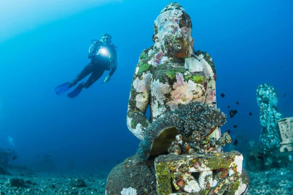 A scuba diver diving in Bali
