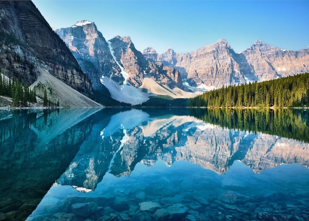 A view of the reflective Moraine Lake in Banff National Park in Canada. And idea for a September Bucket List.