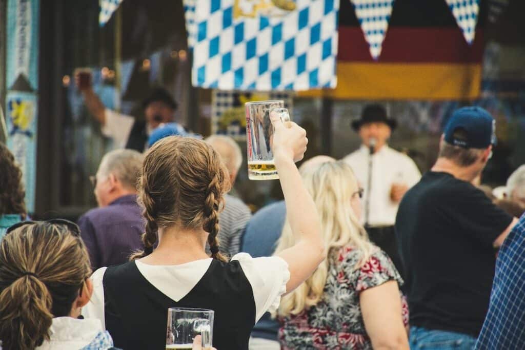 People attending Oktoberfest with beer in Germany