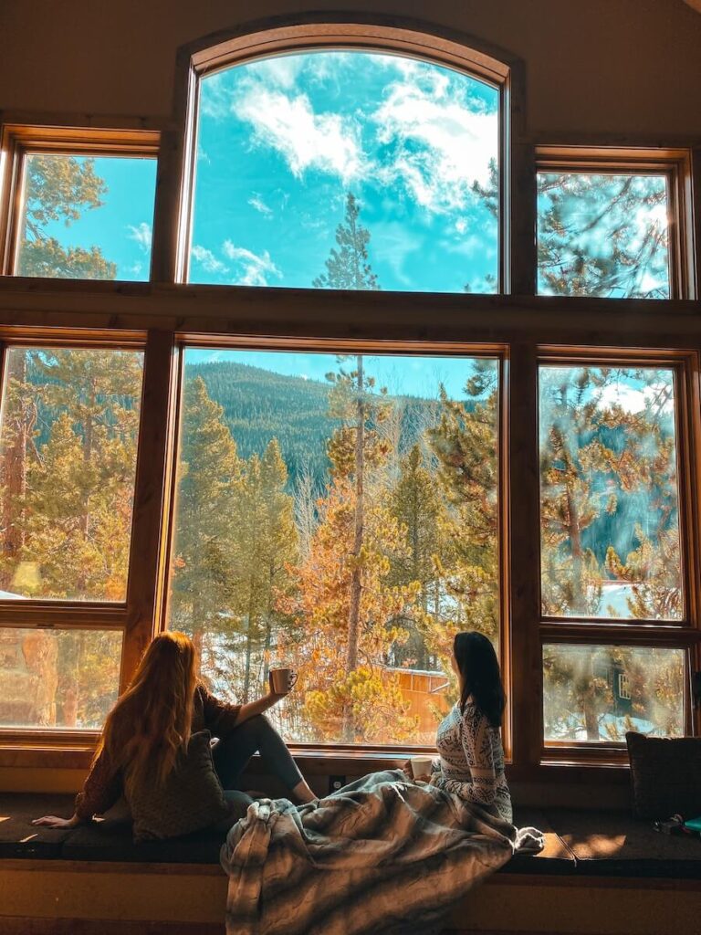 Two friends at a mountain cabin in Colorado