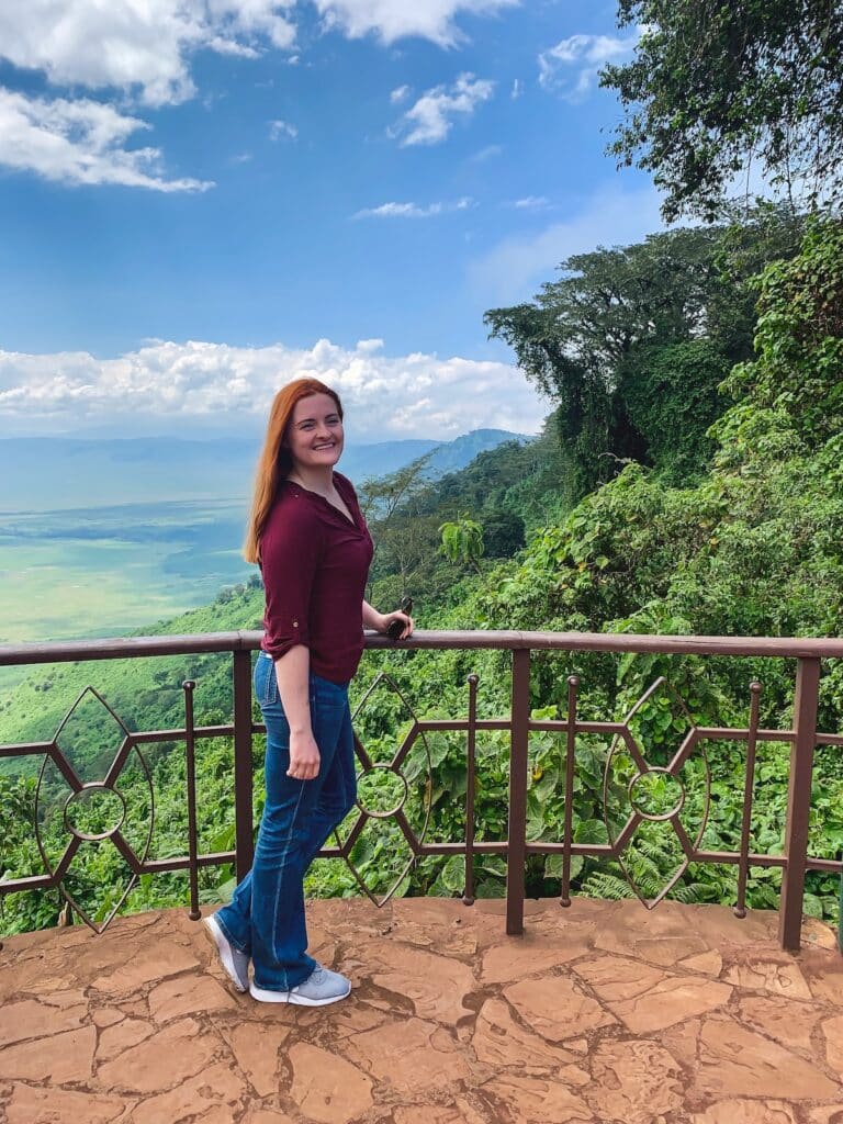 Red haired girl posing over looking in Ngorongoro Crater in Tanzania