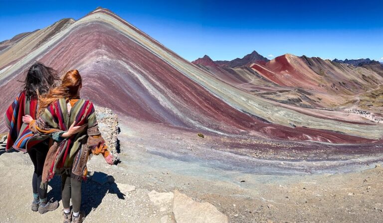 Two friends in traditional Peruvian clothing at Rainbow Mountain, Peru