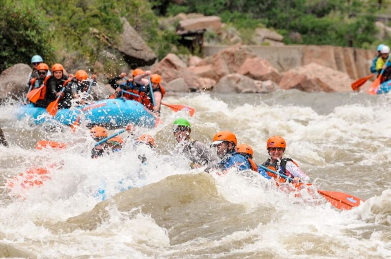 Several boats going down rapids in while rafting the Royal Gorge