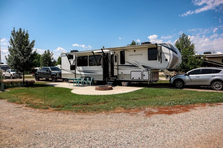 A big fifth wheel parked at an RV Park called Glenwood Springs KOA