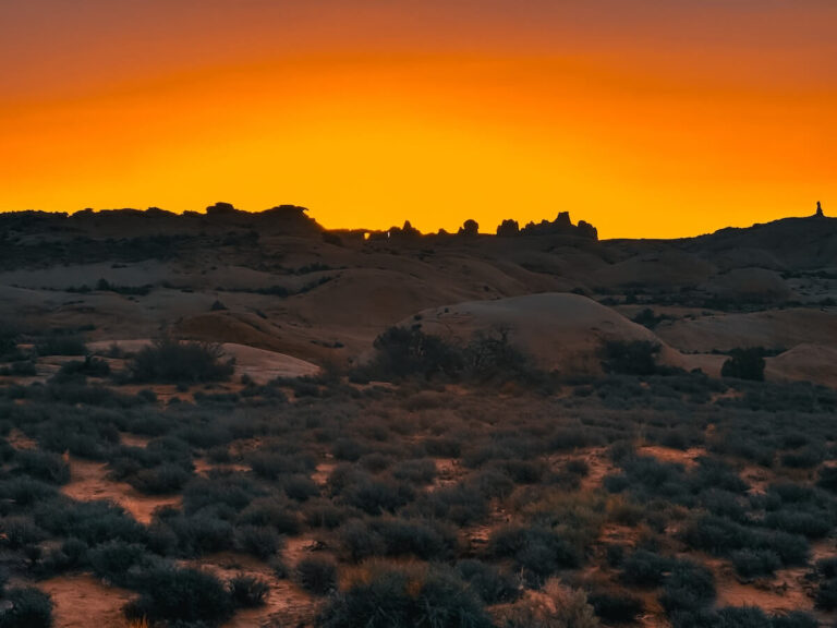 Looking over the petrified dunes in Arches National Park at sunrise.